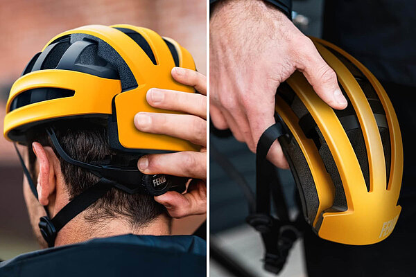 Der Fend nutzt ein Faltprinzip mit seitlich einklappenden Segmenten und lässt sich dabei um rund 50 % verkleinern. oranger Klapphelm von Fend in der Hand