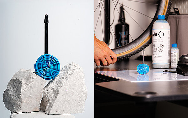 Ein zusammengerollter blauer Fahrradschlauch liegt auf einem Stein.