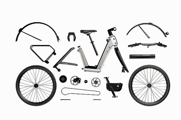 Roetz Bikes präsentiert mit «Roetz Life» ein E-Bike, das der Umwelt zuliebe radikal mit vielen Trends bricht. Teile eines Fahrrads liegen ausgebreitet auf dem Boden.