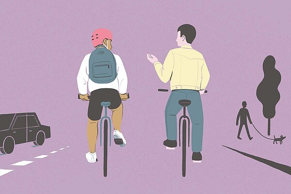 Zwei Männer fahrern nebeneinander auf dem Velo und unterhalten sich