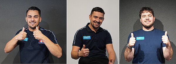 Shimano Service Center European Mechanic Championship. Drei Männer mit T-Shirts, auf denen Shimano steht, posieren für Portraits.