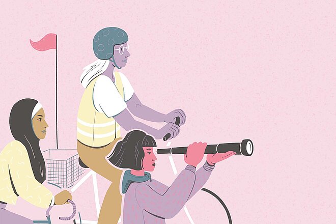 Drei Frauen fahren auf Fahrrädern