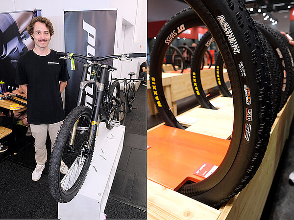 Ein Mann mit Schnauz steht neben einem Mountainbike.