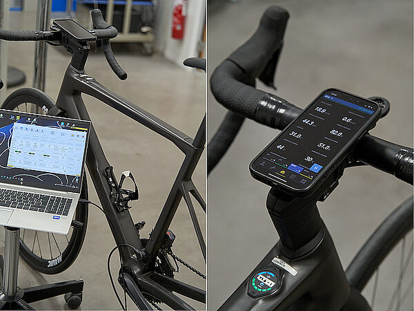 Mavic X-Tend E-Bike Antrieb. Ein Laptop steht neben einem Rennrad.